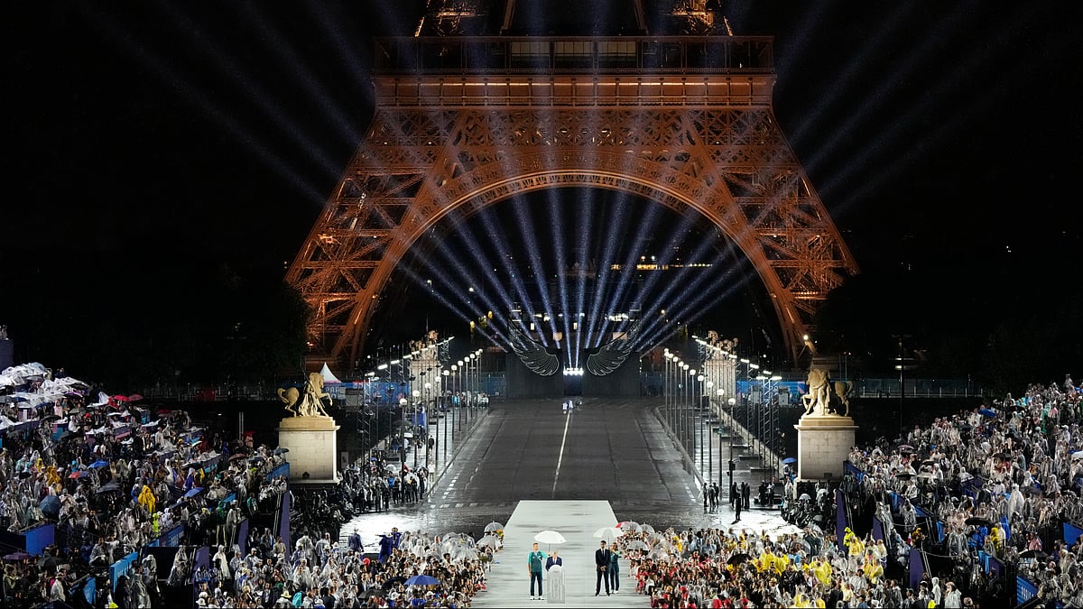 IOC President Thomas Bach speaks as Tony Estanguet, president of 2024 Paris Olympics looks on in Paris, France, during the opening ceremony of the 2024 Summer Olympics, Friday, July 26, 2024. 
 - (AP Photo/David J. Phillip)